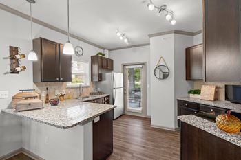 Kitchen with wood/vinyl flooring